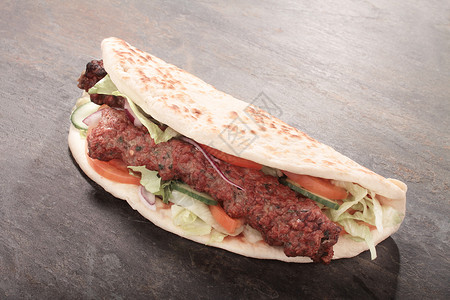 唐纳卡兰Indian 圆环沙拉馕包午餐吃饭腌料餐厅包裹食物时间牛肉背景