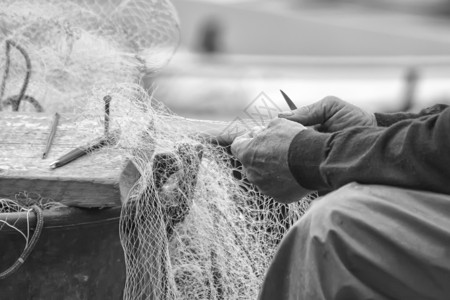 商业性渔民渔网的手掌高清图片