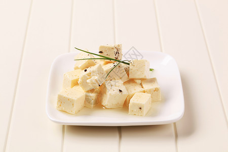 希腊奶酪脱硫乳酪胡椒食物盘子美食立方体奶制品小吃乳酪库存背景