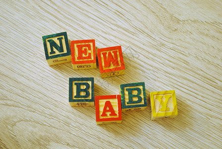 带字母的木制区块游戏婴儿学习孩子们积木背景图片