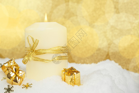 圣诞雪上蜡烛新年卡片丝带白色装饰品烧伤礼物金子展示背景背景图片