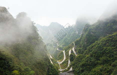 张家吉国家公园天子山自然保护区和雾 中国 中国旅行天气岩石地标烟雾薄雾悬崖爬坡森林街道背景图片