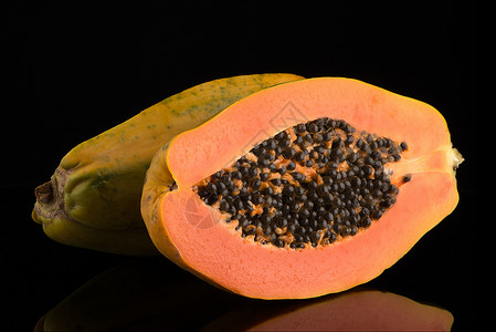 新鲜而美味的木瓜热带橙子甜点水果情调种子维生素异国饮食摸索背景图片