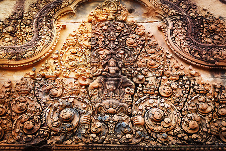 柬埔寨的巴斯救济艺术装饰结构宽慰外观建筑学浮雕砂岩历史风格背景图片