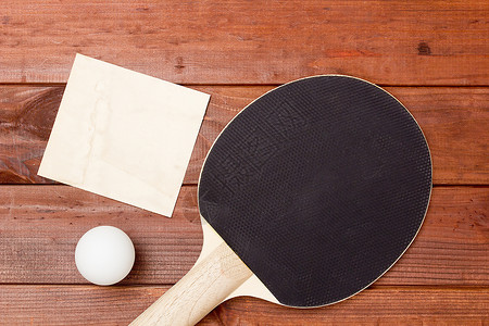 带有黑涂层的桌网球拍桌子木头橡皮运动乒乓乒乓球球拍水平照片圆形背景图片