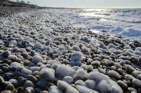 海岸冰盖的石头高清图片