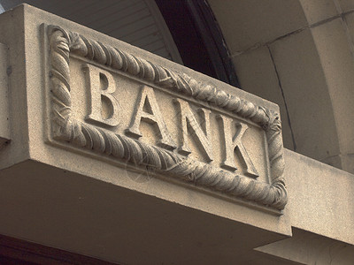 银行金融字母雕刻石头背景图片
