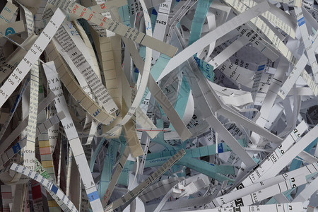 销毁回收的纸张破碎机写作背景图片