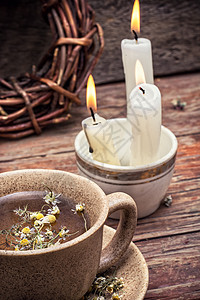 用甘菊汤治愈花瓣早餐治疗药品芳香蜡烛植物草本植物甘菊香气背景图片