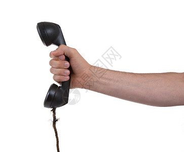 男性手持旧式地面电话水池固定电话拨号商业假期电缆铃声电子产品听筒技术背景图片
