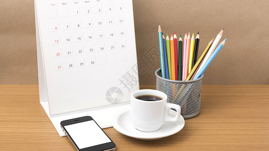 咖啡 电话 日历和彩色铅笔商业工作桌子杯子笔记白色办公室木头记事本职场背景图片