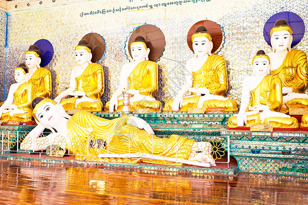 缅甸仰光Shwedagon塔中佛像背景图片