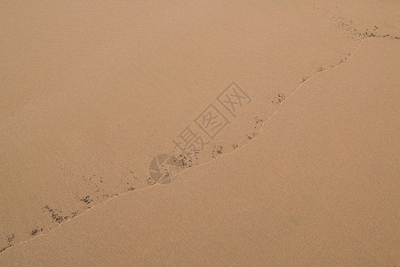 沙沙中的模式土地橙子棕色海岸环境黄色海滩背景图片
