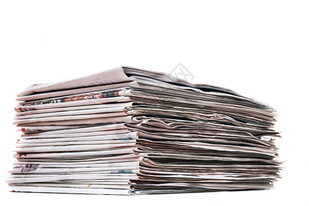 堆积成堆的报纸出版物社论印刷文章打印新闻业背景图片