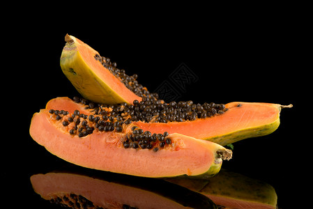 新鲜而美味的木瓜热带水果橙子裂缝异国维生素饮食情调摸索种子背景图片