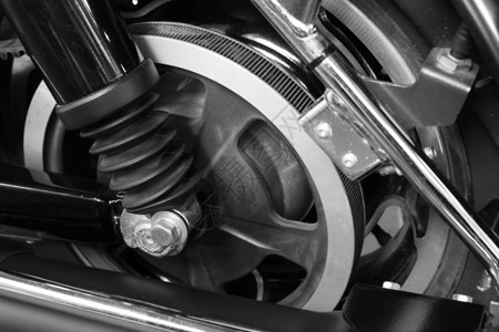 黑色和白色摩托车式的紧紧腰带驱动车轮自行车摩托车发动机驾驶合金菜刀艺术背景图片