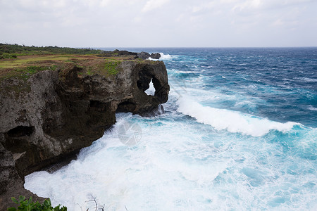 莫逗霸日本冲绳曼扎莫角太阳土地风景地标编队岩石地质学海景悬崖海洋背景
