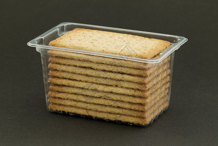 塑料刻板机零食小麦饼干食物膳食生活面包脆皮玉米美味背景图片