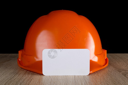 工业橙色头盔黄色小路安全帽塑料剪裁白色生产头饰安全帽子背景图片