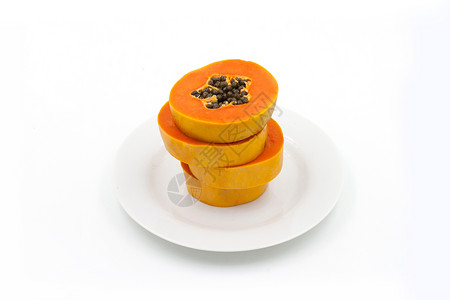 盘子里的红木瓜营养橙子木瓜食物种子甜点热带白色黄色水果背景图片