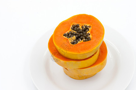 盘子里的红木瓜甜点黄色白色橙子木瓜水果营养热带食物种子背景图片