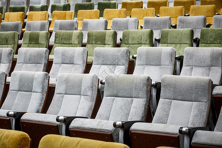 发椅绿色缺陷椅子娱乐天鹅绒大厅电影剧院展示座位背景图片