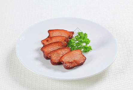 咸猪肉片盘子熏肉食物猪肉油炸背景图片