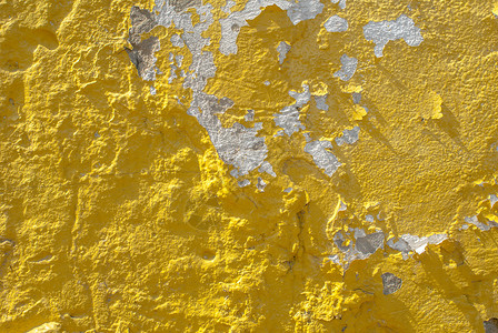 旧石膏墙 风景风格 混凝土表面 大背景或纹理上的薯片涂料合金黄色灰色建筑白色墙纸风化水泥棕褐色石头背景图片