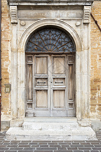门施利赫典型的意大利门棕色石头房子入口建筑风化木头古董建筑学背景