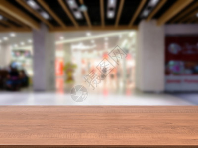 在模糊商场前面的木板空桌产品柜台嘲笑部门剪辑走廊购物中心台面大厅建筑背景图片