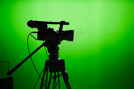 电视演播室相机数码绿色工作室广播屏幕生产镜片三脚架技术背景图片
