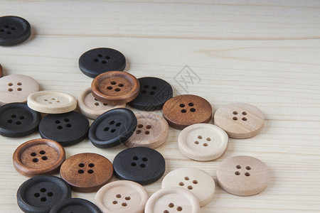 木制手工按钮纽扣纺织品圆形衣服木头棕色手工业工艺爱好收藏背景图片