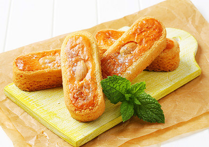 荷兰杏仁饼干鸡蛋花蛋糕库存杏仁羊皮纸甜点食物砧板小吃饼干背景图片