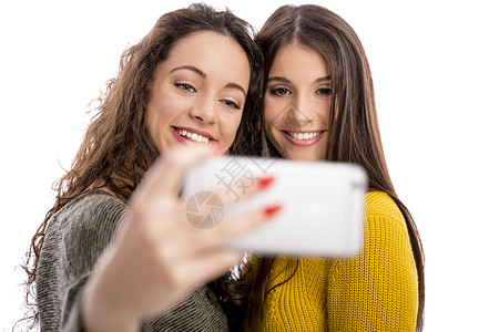 女孩自拍乐趣摄影幸福手机朋友们技术电话闲暇友谊情感背景图片