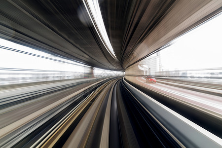 日本单轨铁路的模糊城市过境旅行隧道曲线运动火车小时踪迹速度背景图片