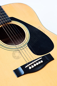 白色背景的音乐吉他民间材料指板乐器烦恼木头水平细绳海报摄影背景图片