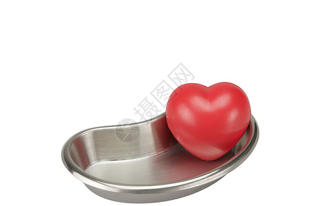 中中把心在不锈钢铁肾形碗中的红心背景