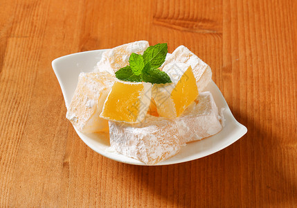 果冻果冻立方体希腊土耳其喜悦食物糖果糖粉明胶美食涂层甜点正方形乳香软糖背景图片