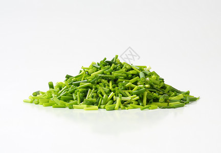 被选中的爪子绿色洋葱树叶烹饪草本植物食物背景图片