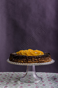 橙色蛋糕加蜂蜜宏观海绵广告胡桃巧克力早餐橙子橘子糕点水果蛋糕背景图片