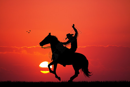日落时的竞拍牛仔插图荒野马背男人动物鬃毛背景图片