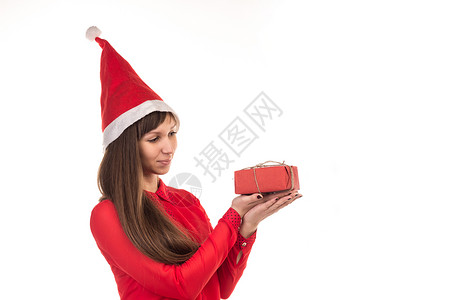 穿着红圣诞帽和红礼盒的长头发妇女背景图片