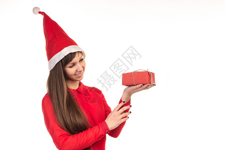 穿着红圣诞帽和红礼盒的年轻女孩背景图片