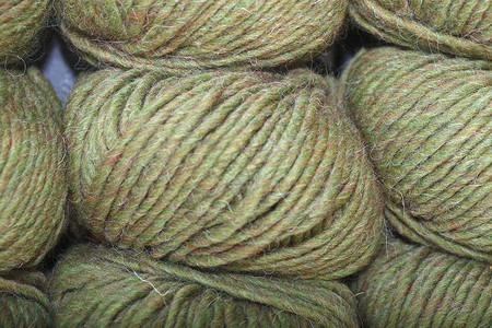 织毛的毛球棉布针织羊毛羊毛球零售织物绿色背景图片