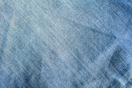 牛仔面料的质地帆布材料牛仔裤蓝色宏观棉布织物衣服服装空白背景图片