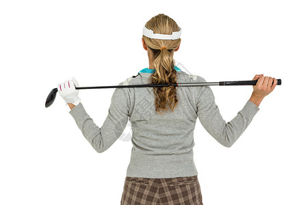 高尔夫高尔夫球运动员举办高尔夫俱乐部运动头发专注女士活力女性休闲爱好服装娱乐背景图片