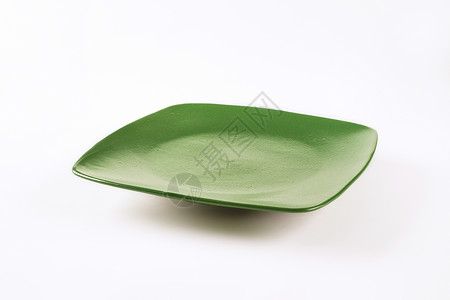 绿色晚餐餐盘餐具纯色正方形沙拉盘背景图片