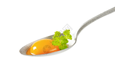 勺子上生蛋黄食物汤匙金属背景图片