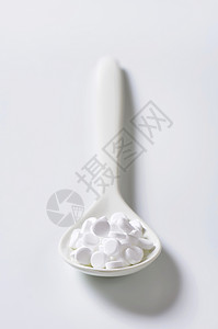 人造甜甜剂平板糖精热量食品白色药片背景图片