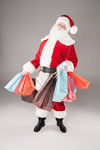 带购物袋的圣诞老人问候语背景图片